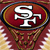 Static pixelated icon featuring a stylized white 'SF' logo on a red oval background with gold and dark blue borders, set against a blurred maroon backdrop with light speckles.