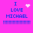 A bright pink background displays four identical blue text blocks reading "I LOVE MICHAEL" with exclamation marks, each paired with a distinct white pixelated symbol above the text.