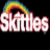 Pixelated rainbow arch above stylized text with 'taste the rainbow' in blocky white letters on black background.