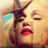 A pixelated image of a woman with blonde hair and red lips, showing text changes across frames.