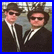 Two side-by-side pixelated images of people in dark suits with white shirts and sunglasses, next to a text-based logo reading "THE BLUES BROTHERS" on black background.