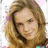 A pixelated image of a person with light brown hair on a red background with black text reading "She Is Hot Fine Sexy Beautiful & All Mine!".