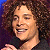 A pixelated image showing a person with curly hair on the left and green text reading "Original Icons .com" on a dark green background to the right, presented as part of an animated contact sheet frame.