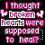 Pixelated text in pink and white on black background with broken heart symbols flanking the word 'broken'.
