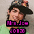 Pixelated image of a person with dark hair wearing a black hat and green shirt, overlaid with pink text reading "Mrs. Joe Jonas" on two separate lines.