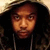 A person with long dark hair wears a hooded jacket, first facing forward then turning right in a animation
