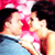 Static 50x50 pixel icon showing two people kissing with visible red and blue color blocks, pink highlights, and dark background elements.