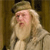 Pixelated image of a person with long light-colored hair and beard wearing a light robe and hat, standing against a dark brown background.