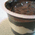 A split image shows a bowl of brown pudding on the left and a cow's face with black-and-white patches on the right, below which is text reading "Cows like pudding".