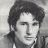 Black-and-white pixelated portrait of a person with dark hair on the left, green text reading 'Original Icons .com' on the right against a solid background.