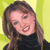 Pixelated image of a person with long brown hair wearing a black turtleneck against a yellow background.