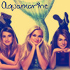 Three women pose with hands under chins against a yellow background with a green mermaid tail graphic and 'Aquamarine' text above.