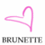 A static pixelated icon featuring a pink heart outline with a trailing line and the text "BRUNETTE" in gray block letters below it on a white background.