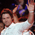 A person in a white shirt raises both hands with palms open against a dark background, while red text reads "BYE!" twice on the right.
