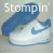 Four- shows white Nike sneakers with blue swooshes and soles, each displaying different text or a red heart symbol on the shoe's side