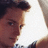 Pixelated image of a person with brown hair and light skin, next to white pixelated text on black background reading "Eijah is hot like a taco!".