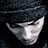 A split-frame contact sheet showing a pixelated grayscale portrait on the left and green text logo on the right against dark background.