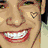 Six distinct pixelated images of a smiling person with short dark hair, displayed in a with varied backgrounds and clothing
