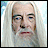A pixelated split-screen image shows a character with long white hair and beard on the left, next to 'LORD OF THE RINGS THE TWO TOWERS' text in gold lettering on black background.