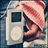 Pixelated image of a person with a pink striped towel on their head holding a white MP3 player, with text overlays changing across frames.