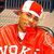 A pixelated figure in a red jacket and Santa hat with white text at the bottom, set against a blurred background.