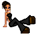Pixel art avatar of a woman in a crouched pose with one leg extended, wearing a black strapless top and black pants, brown shoes, and earrings.