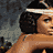 Animated contact sheet showing six sequential frames of a woman with dark curly hair wearing a white headband and white top, displaying subtle facial expression changes across the animation sequence.