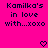 Bright pink background with dark blue pixelated text reading "Kamilka's in love with...xoxo" and two heart symbols below.