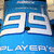 Blue background with white stylized 'SE' characters and partial text below, pixelated rendering.