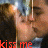 A four- shows a person with dark hair and metallic headgear, red text reading 'kiss me' across each , and visible pixelation