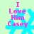Pixelated text 'I Love Him Casey' over a cyan snowflake on light green background with animation changes in letter clarity and shape.