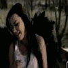 Animated sequence of a woman in a white tank top with long dark hair, transitioning through multiple poses and expressions against a blurred outdoor background.
