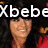Pixelated image of a person with long dark hair wearing red clothing, overlaid with white text "Xbebe" on black background.