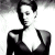 Black-and-white pixelated image of a person in a low-cut top on left, green background with bright green text 'Original Icons .com' on right.