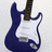 Two identical blue electric guitars with white pickguards and brown necks, side-by-side on a light gray background.
