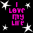 Black background with four identical pink text blocks reading "I LOVE MY LIFE" surrounded by white star shapes.