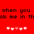 Red background with pixelated black text reading 'when you when you ok me in thok me in th' and two of white/pink heart symbols