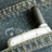 Blue background with pixelated text and a small grayscale image of a phone in a pocket.