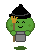 Green pixelated character with black pointed hat, yellow hand, brown staff, gray bucket, and smiling face on gray background.