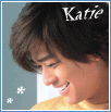 A 2x2 contact sheet of three animated frames showing a person with brown hair in profile, wearing a yellow top against a teal background with white snowflake symbols and the name "Katie" displayed above.