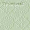 A static image of four identical lace-like floral patterns arranged in a 2x2 grid on a pale green background with no visible text or distinct objects.