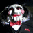 Pixelated cartoon character with white face, red bow tie, and pink cheeks against dark background.