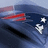 Pixelated image of a dark blue vehicle with red accents and white circular lights on the right side against a light blue background.