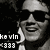 Pixelated grayscale image of a person wearing sunglasses and a cap, with text reading 'kavln' and '1999' in the lower-left corner.