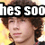 Pixelated image of a person with brown curly hair wearing a black headband with white text reading 'hes so' against a yellow background.