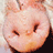 Animated pig face with closed eyes in first frame, transitioning to open eyes in second frame against light background.