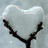 Six heart-shaped compositions in a : snow-covered branch, sunlit water reflection, green foliage with white outline, autumn leaves, dark silhouette against sunset, and cloud formation