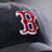 A pixelated red and white stylized letter B with blue inner details on a dark gray background.