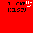 Red background with black text reading "I LOVE KELSEY" on both sides, left side features a white pixelated heart replacing the 'O' in LOVE.