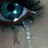 A close-up of a blue eye with long dark eyelashes, showing subtle animation changes in the iris and pupil.